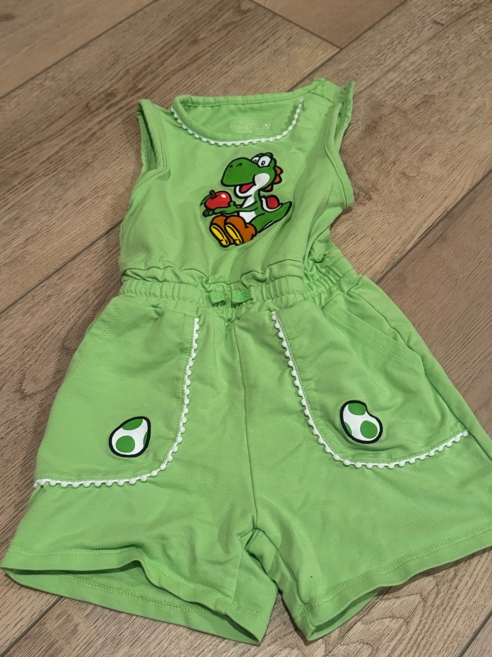 Green Yoshi Graphic Romper. Purchased at Universal.